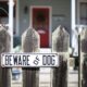 Photo of a beware of dog sign on a fence