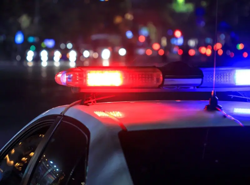 photo of a police car with its emergency lights on