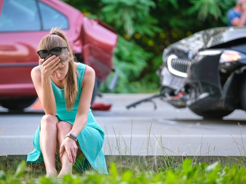 photo of an injured woman at car accident scene