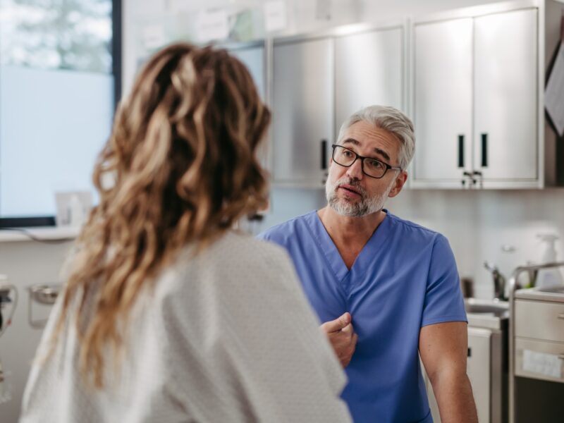 photo of a doctor speaking to a female patient