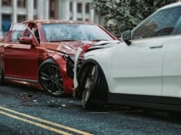 photo of two cars involved in a head on collission