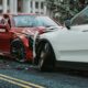 photo of two cars involved in a head on collission