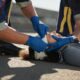 photo of paramedics treating an injured woman at a car accident scene